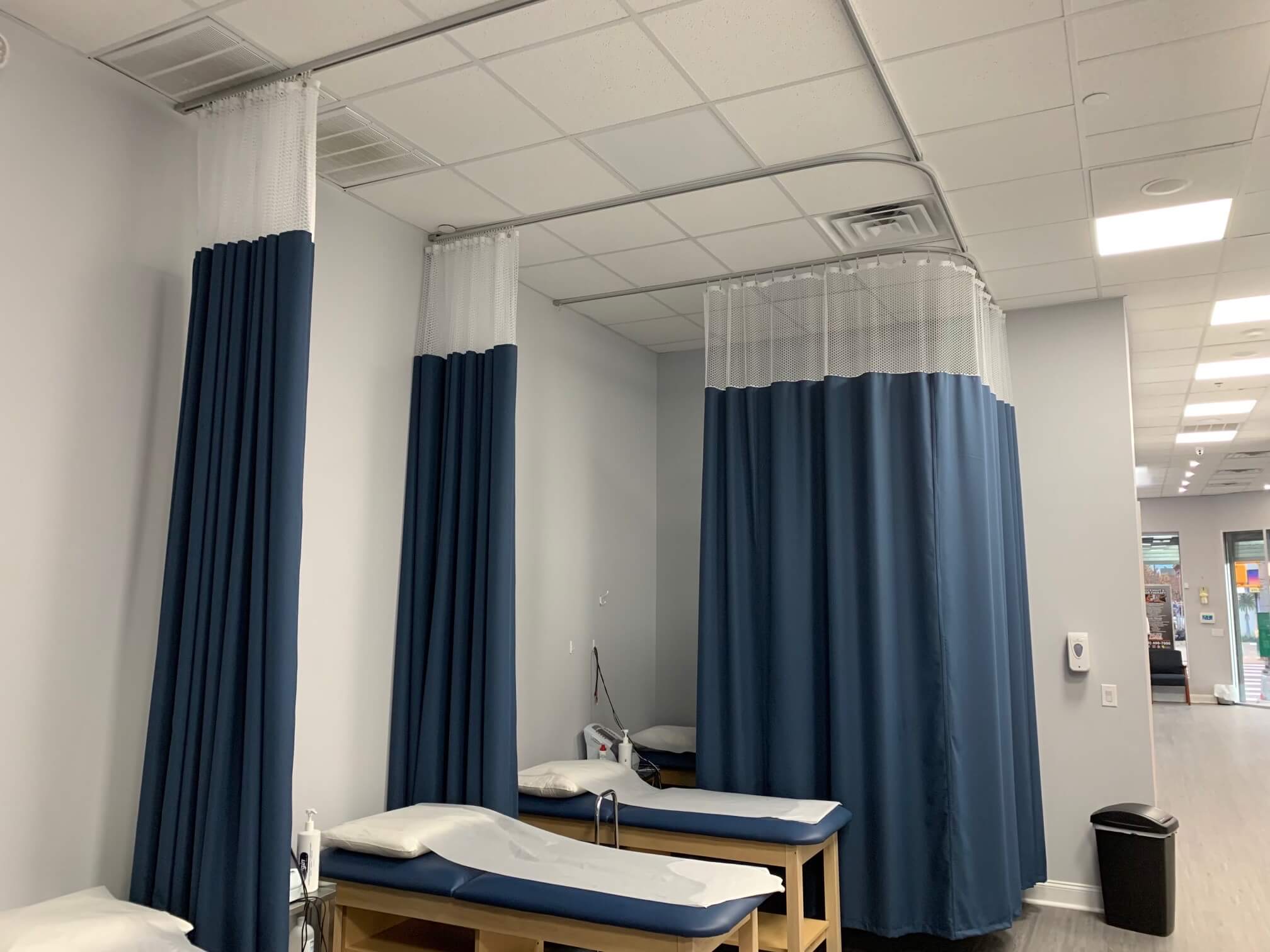 Blue hospital cubicle curtains around bed available in Toronto